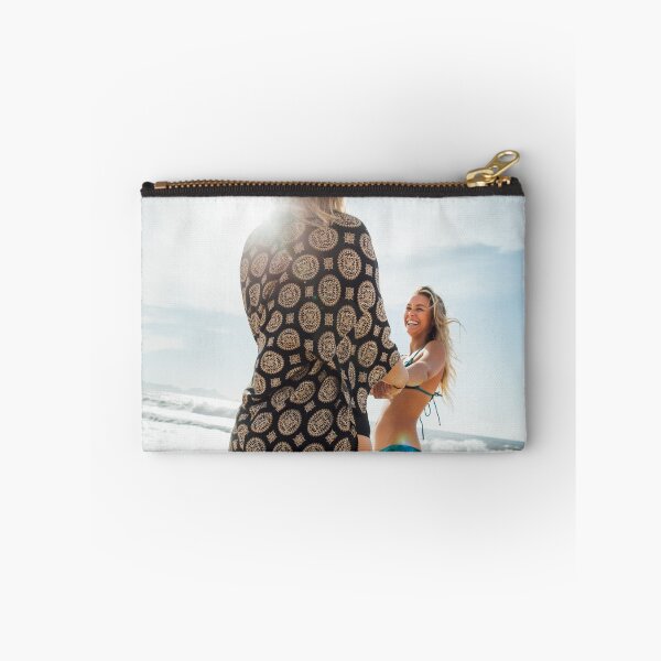 Item preview, Two Young Pretty Blond Girls Holding Hands and Laughing Together on Sunny Beach designed and sold by visualspectrum.