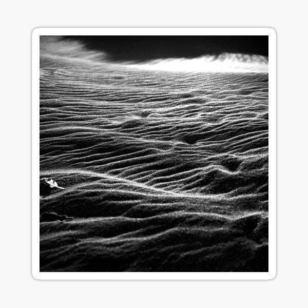 Ripples of black sand Sticker