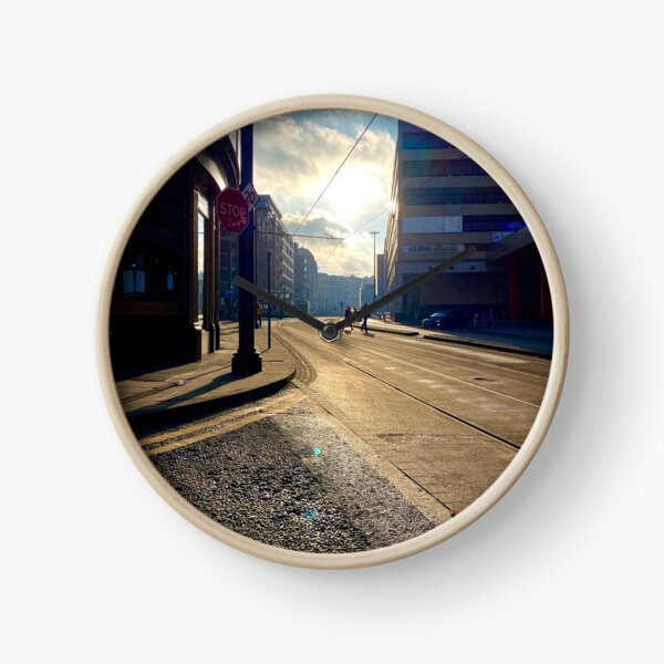 Manchester high street, golden hour. Clock