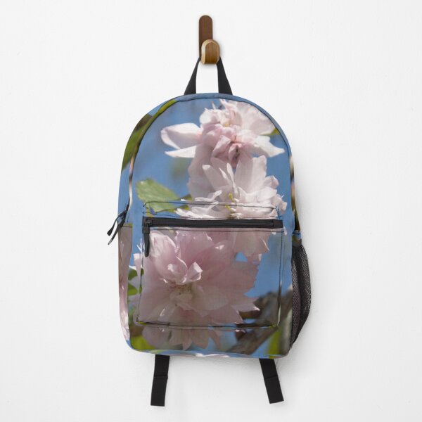 Item preview, light pink flowers on a tree branch against a blue sky background designed and sold by nataliavavilina.