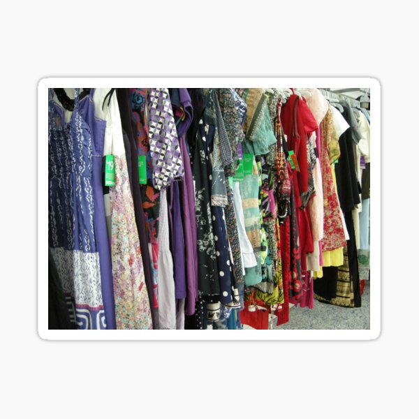 an op shop rack full of bright colourful hippy clothes Sticker