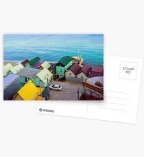 Many color houses on the coast of the sea Postcards