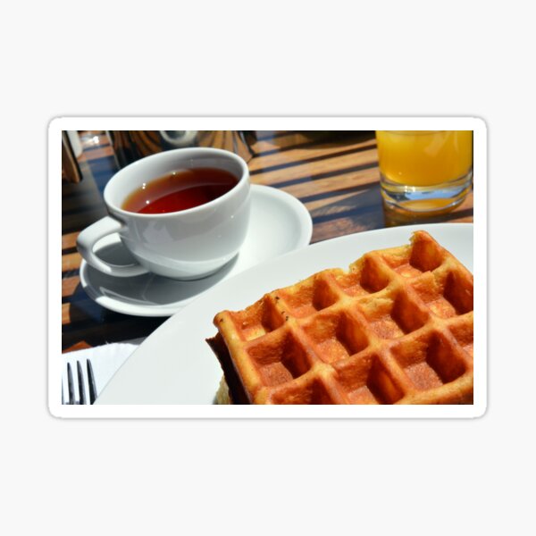 Breakfast or desert with waffle, a cup of tea and orange juice. Sticker