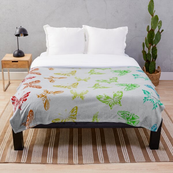 Aperçu de l'œuvre Motif de papillons arc-en-ciel ombré sur fond gris créée et vendue par ShowMePrints.