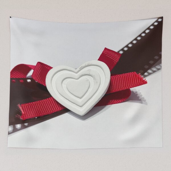 Item preview, A white heart with red ribbon resting on a photographic film designed and sold by brambillasimone.