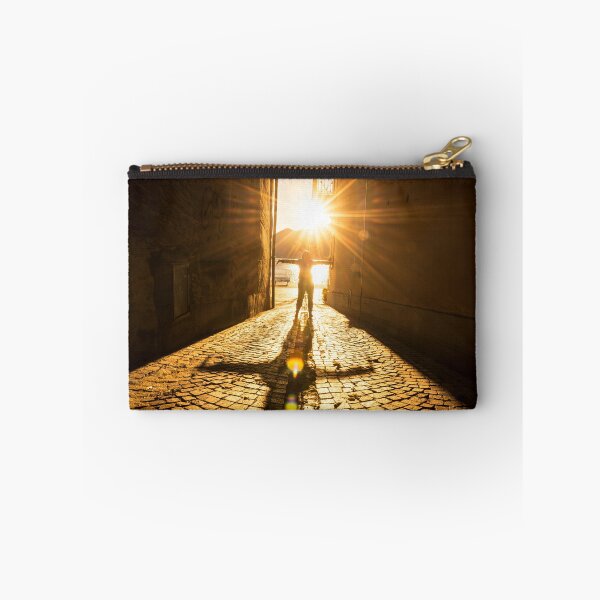 Item preview, Woman with Arms Outstretched Standing in a Narrow Street with Sunbeam and Shadow designed and sold by Mats Silvan.