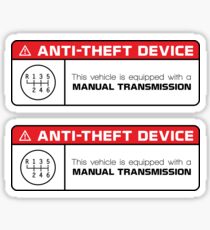 Pegatina Dispositivo antirrobo: advertencia de transmisión manual