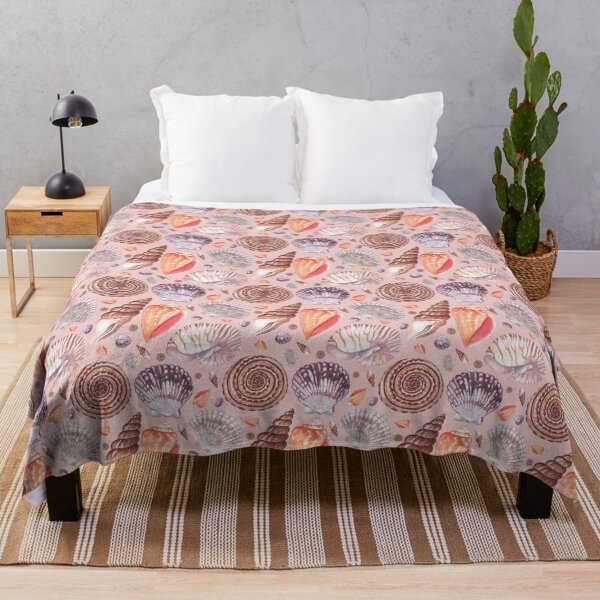 Item preview, seashell illustrations in warm colors seamless pattern on the peach background designed and sold by linagaiaart.