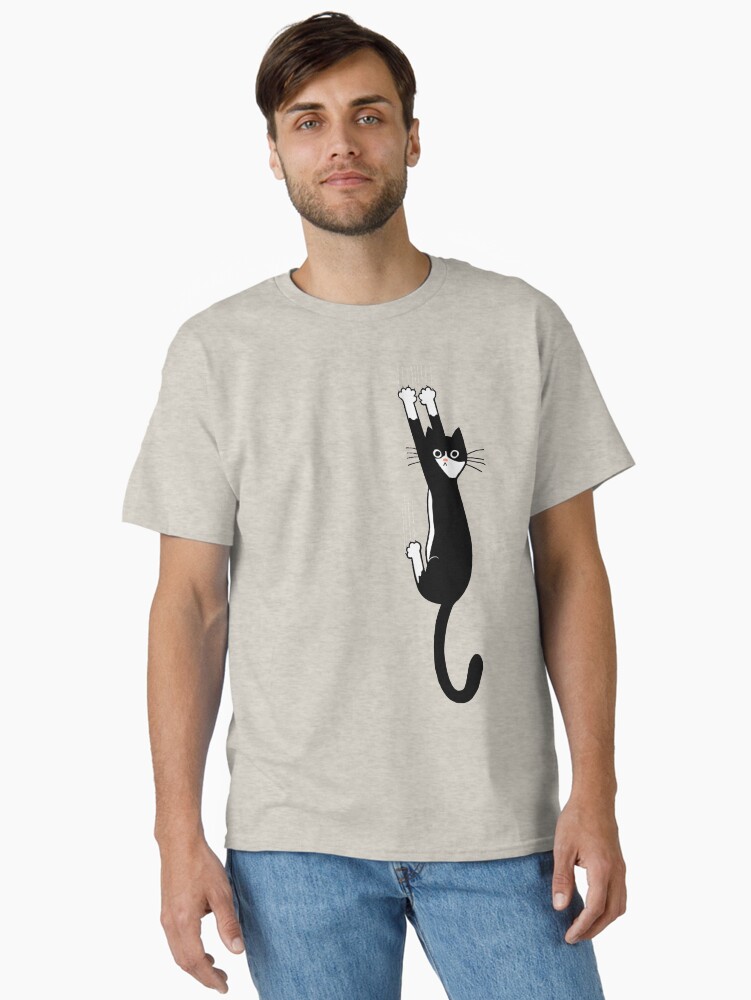 Thumbnail 1 of 7, Classic T-Shirt, Black and White Cat Hanging On | Funny Tuxedo Cat designed and sold by ShortCoffee.