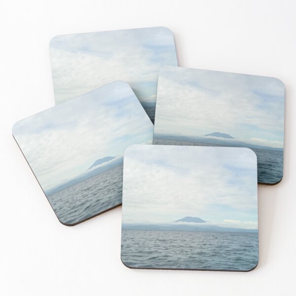Item preview, landscape a volcanic island in the ocean and the blue sky above it designed and sold by nataliavavilina.