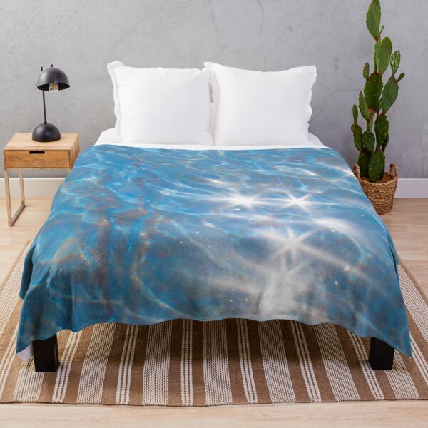 Item preview, blue water with sun glare on it close-up designed and sold by nataliavavilina.