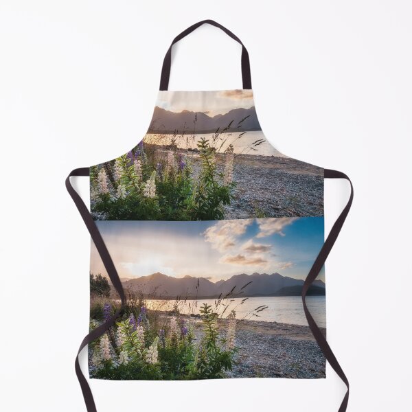 Item preview, Beautiful sunset light at Lake Te Anau with flowers in foreground, New Zealand designed and sold by Danielasphotos.