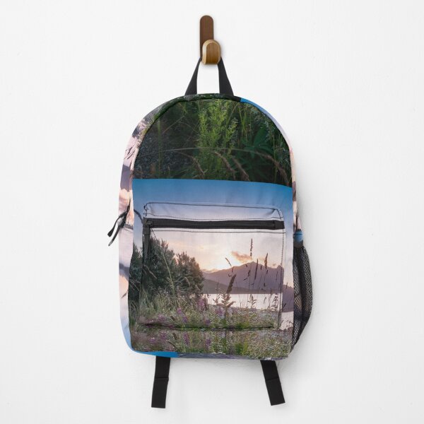 Item preview, Beautiful sunset light at Lake Te Anau with flowers in foreground, New Zealand designed and sold by Danielasphotos.