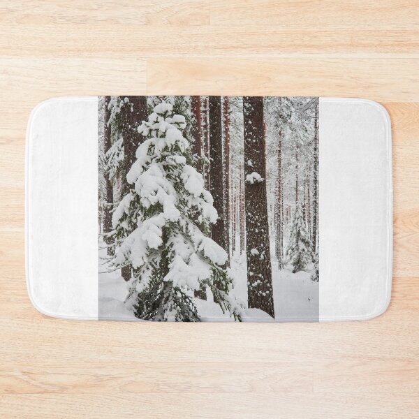 Item preview, Green spruce and red pines covered with white snow designed and sold by Jouko Lehto Photography.
