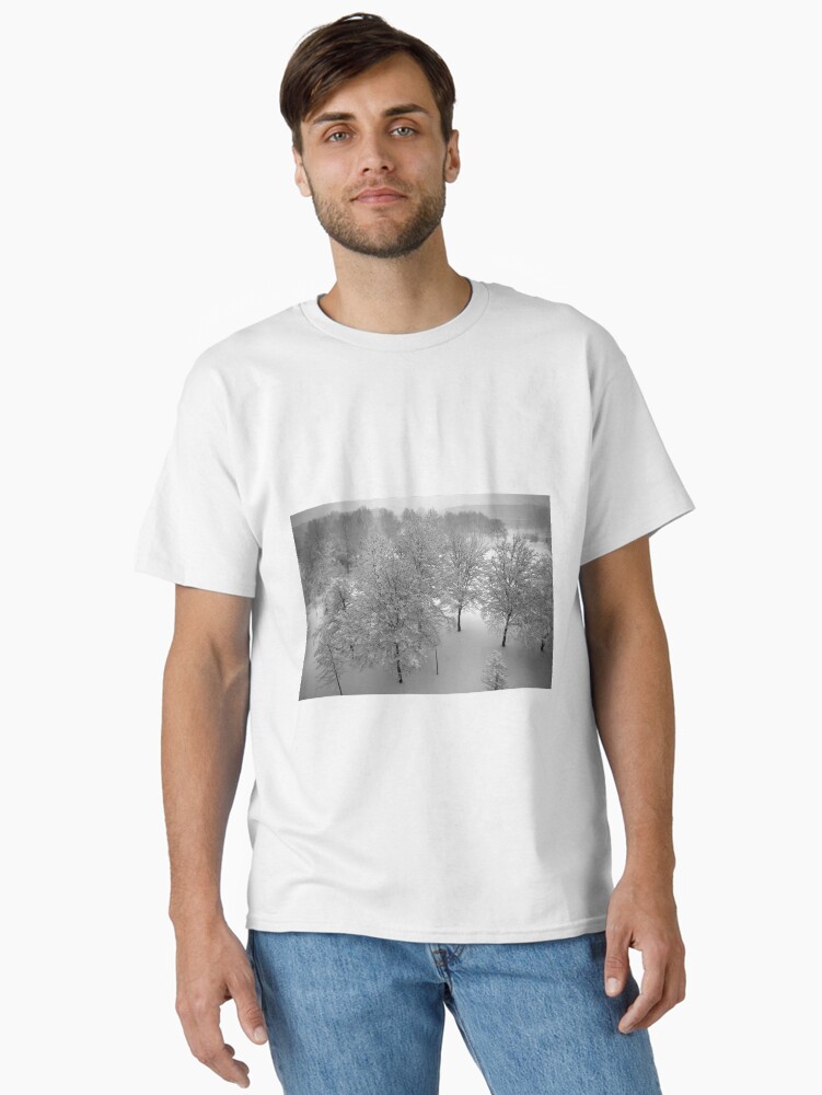 Thumbnail 2 of 7, Classic T-Shirt, Looking down on snowy trees designed and sold by steppeland.