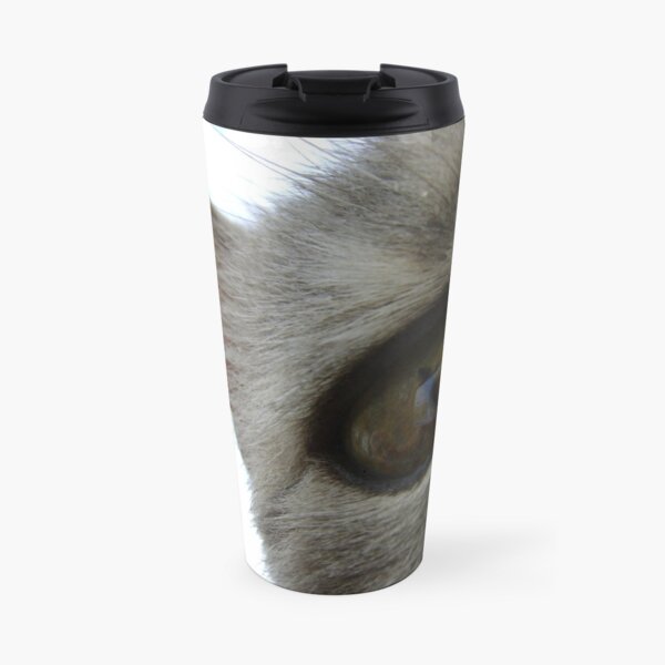 in a cat's eye Travel Mug