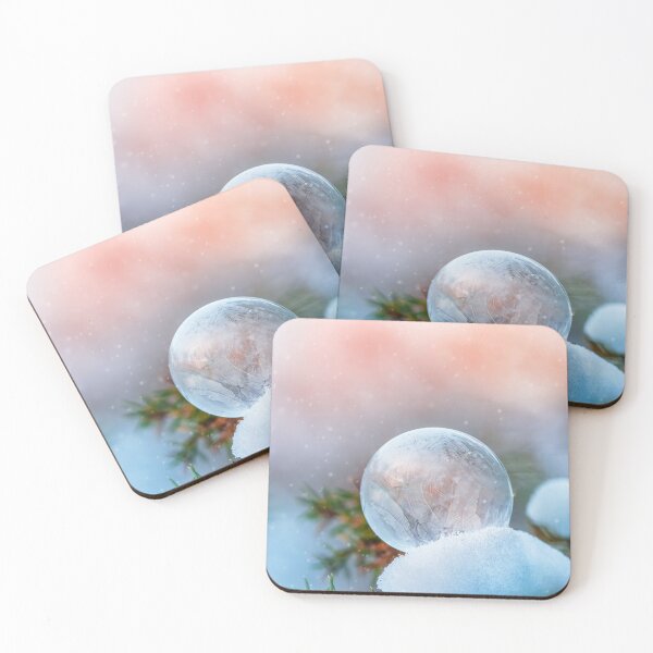 Item preview, Macro of frozen soap bubble on a tree branch. Beautiful orange sunset background with snowfall designed and sold by macroviewpoint.