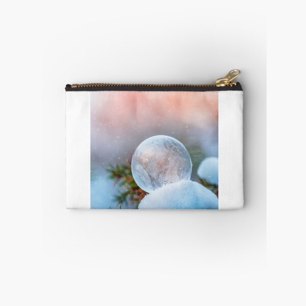 Item preview, Macro of frozen soap bubble on a tree branch. Beautiful orange sunset background with snowfall designed and sold by macroviewpoint.