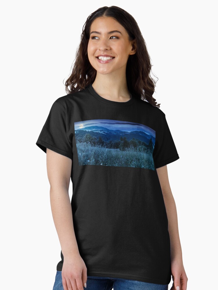 Thumbnail 1 of 7, Classic T-Shirt, panorama of a meadow in mountains at night designed and sold by mike-pellinni.