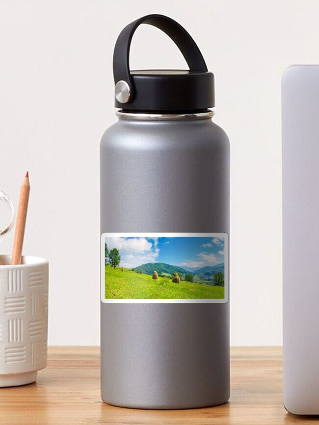 Thumbnail 1 of 3, Sticker, haystacks on a grassy hill in summer designed and sold by mike-pellinni.