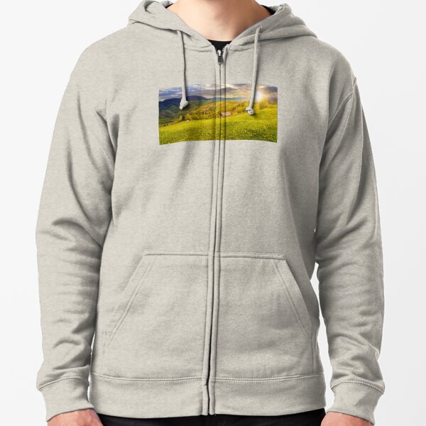 dandelions on rural field in mountains at sunset Zipped Hoodie