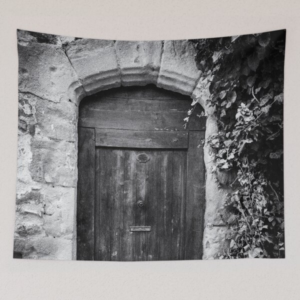 Item preview, Black and white photo of a secret mysterious old door overgrown with ivy in France designed and sold by Diana van Neck.
