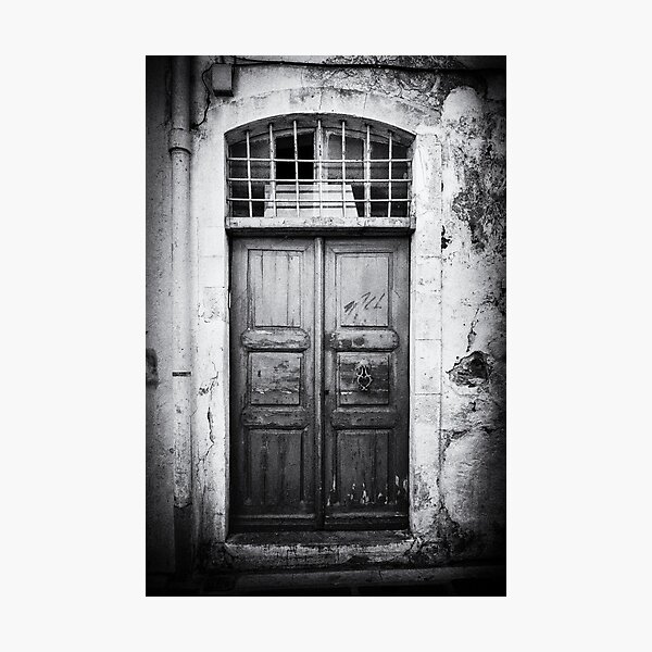 Photo of an old wooden door on the island of Crete, Greece in black and white Photographic Print