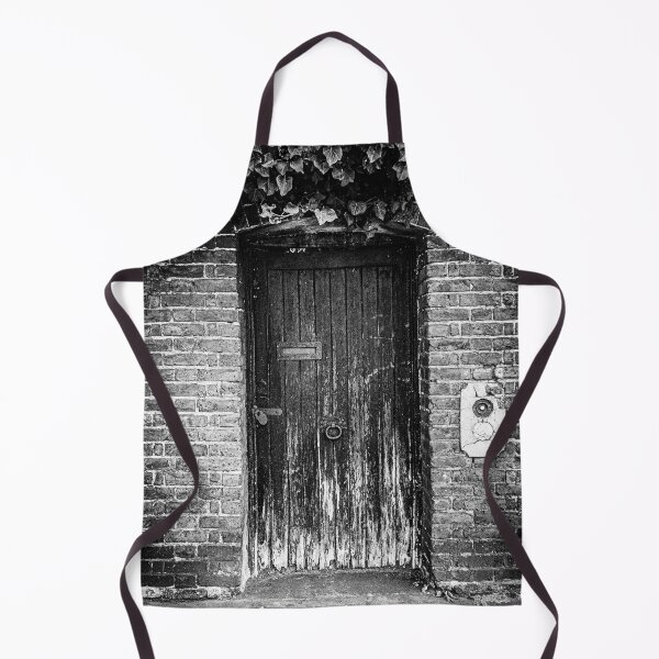 Item preview, Black and white photo of a closed weathered door to a secret garden in London designed and sold by Diana van Neck.