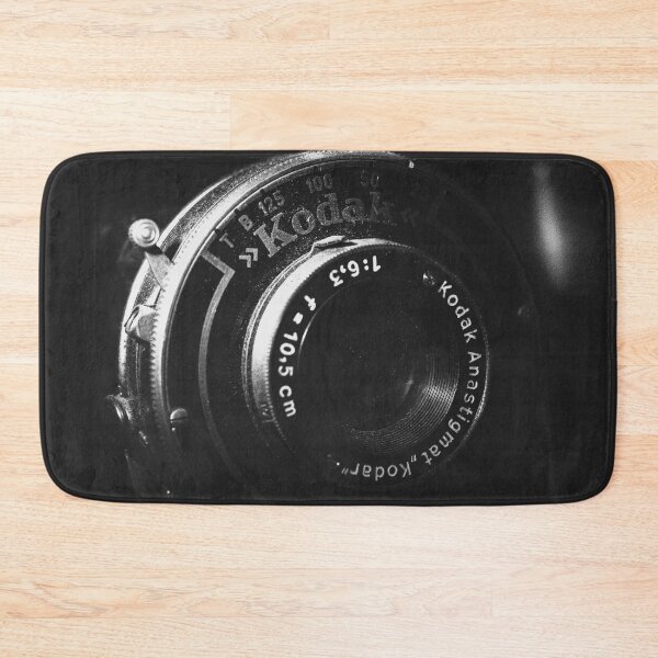 Item preview, A black and white close-up photo of a vintage analog camera designed and sold by Diana van Neck.