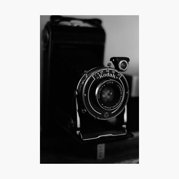 Close-up photo of a retro analog camera in black & white Photographic Print