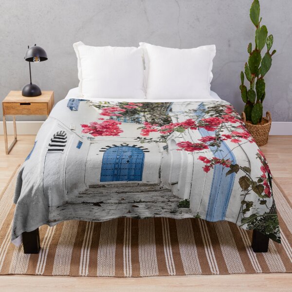 Item preview, Alley with blue door and pink blossom in Tunisia designed and sold by Melissa Peltenburg.