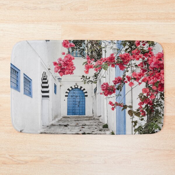 Item preview, Alley with blue door and pink blossom in Tunisia  designed and sold by Melissa Peltenburg.