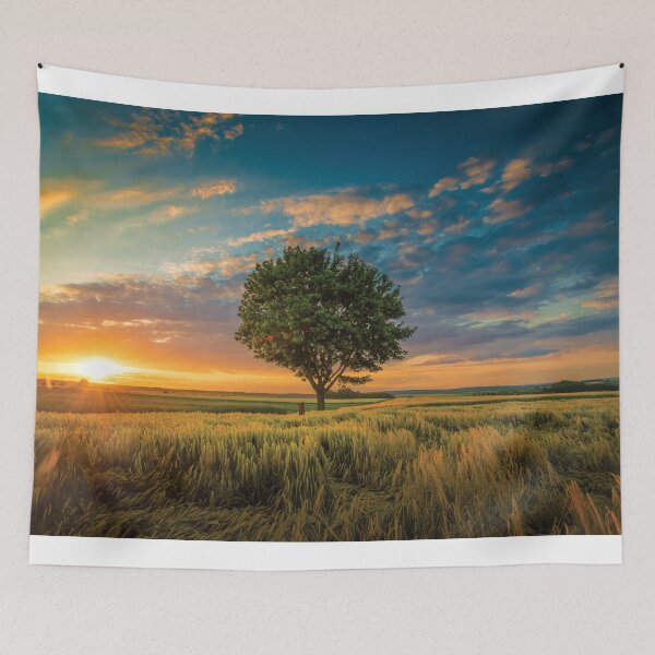 Item preview, Big tree surrounded by grass in the jungle designed and sold by kikinafashion.