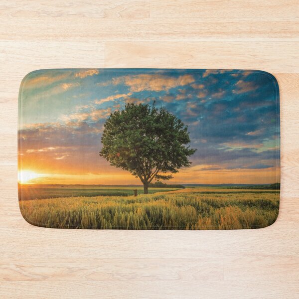 Item preview, Big tree surrounded by grass in the jungle designed and sold by kikinafashion.