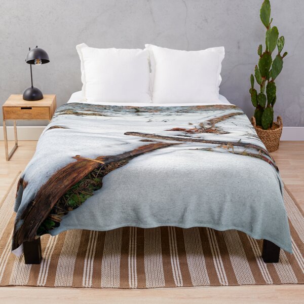Item preview, Crossing tree trunks in the snow designed and sold by frankuffmann.