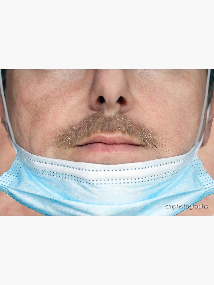 A badly worn medical mask - Man by cmphotographs