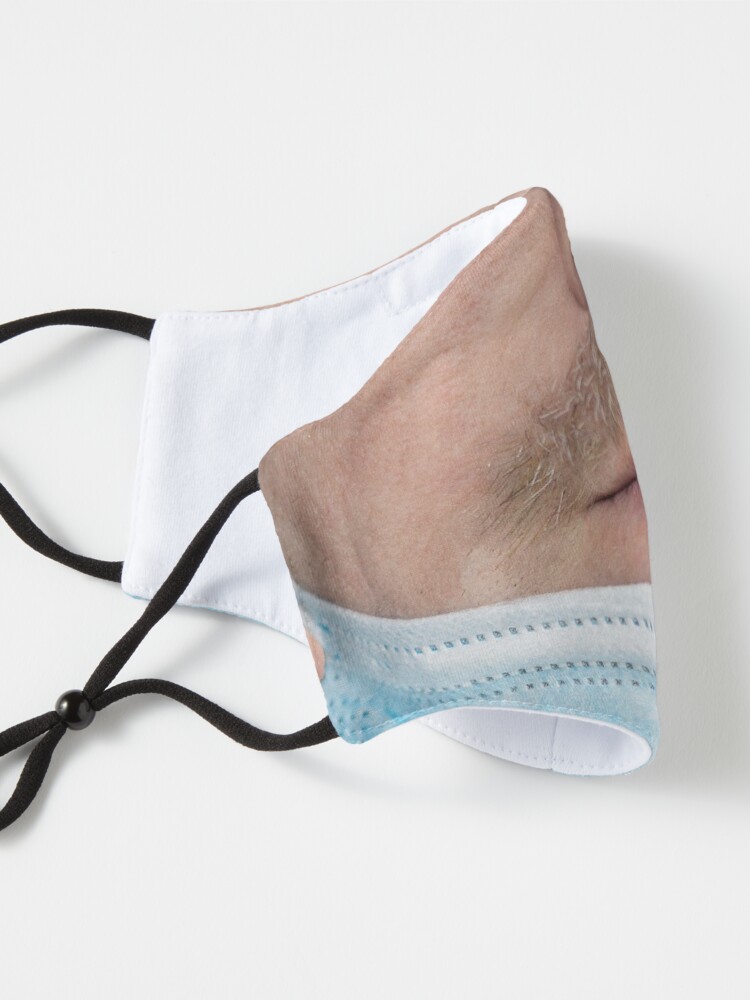 Alternate view of A badly worn medical mask - Man Mask