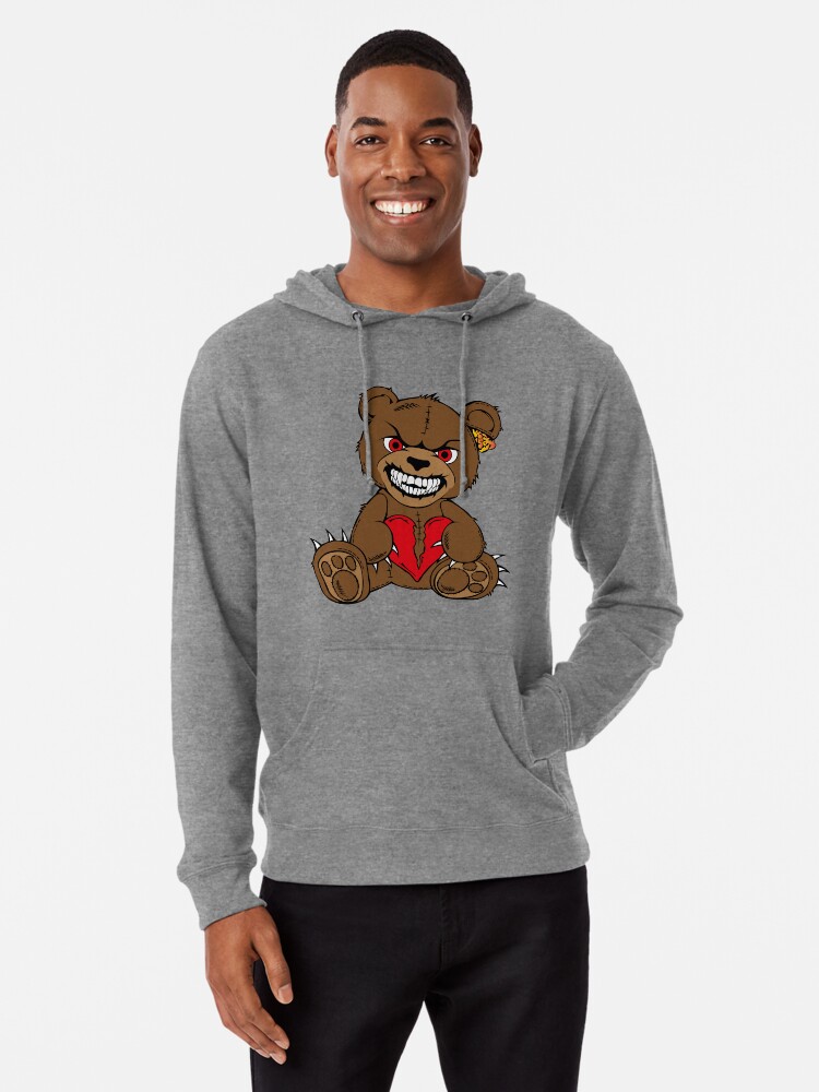 Brown evil teddy bear with red eyes and broken heart
