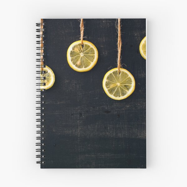 Item preview, Lemon slices on the rope on a black background designed and sold by olhakozachenko.