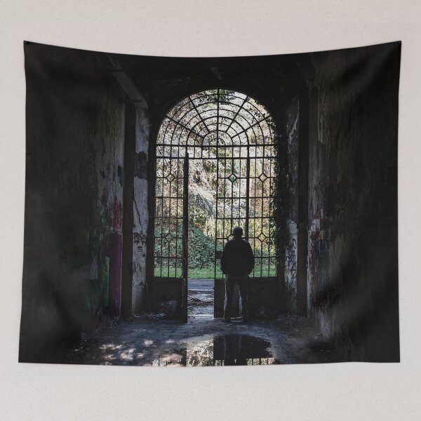 Item preview, Silhouette of a man observing the outside world looking from the grate of a door designed and sold by brambillasimone.