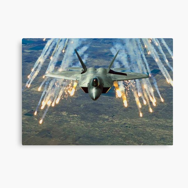 F-22 Raptor firing flares in defence Canvas Print
