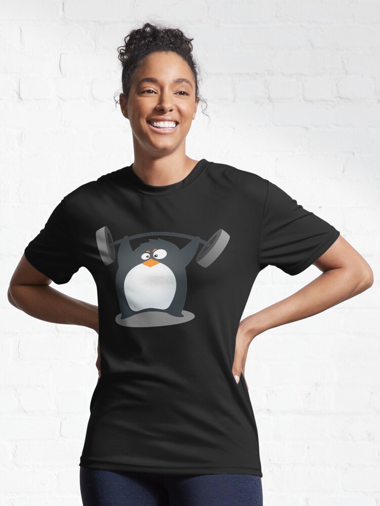 Aperçu 6 sur 7. T-shirt respirant avec l'œuvre Pingouin mignon de musculation fitness créée et vendue par flintmoon.