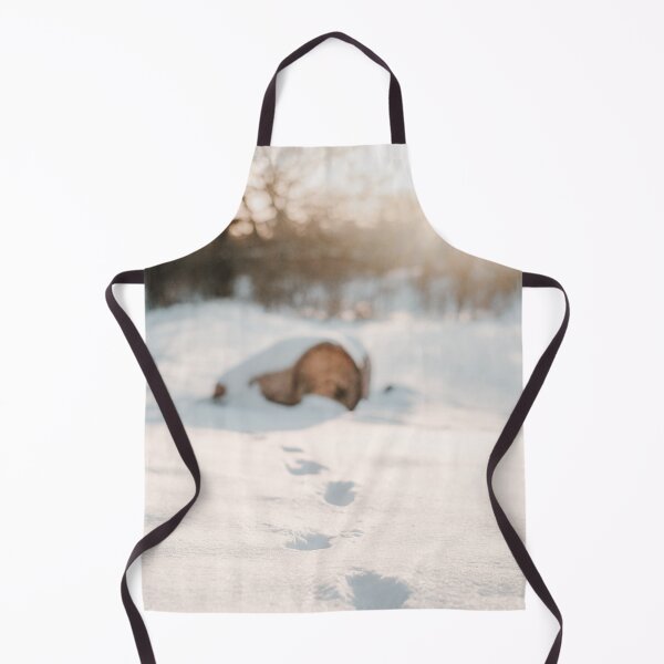Item preview, Footsteps in snow, tree trunk and sunset in background designed and sold by Melissa Peltenburg.