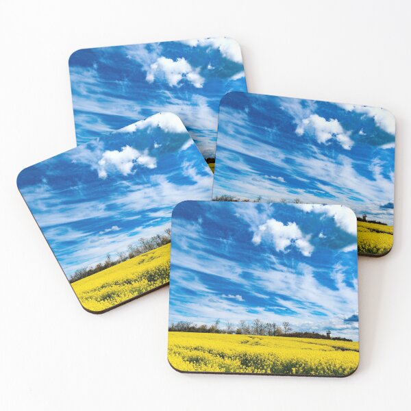 Item preview, Yellow field of rapeseed under a blue sky with whispy clouds designed and sold by Michael Brewer.