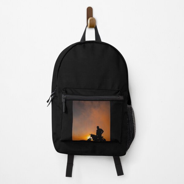 Item preview, Silhouette of motorbike and person in the sunset, with orange and yellow colors. designed and sold by AylaHarbich.
