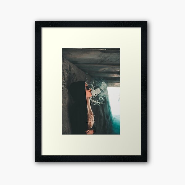Woman leaning against wall Framed Art Print
