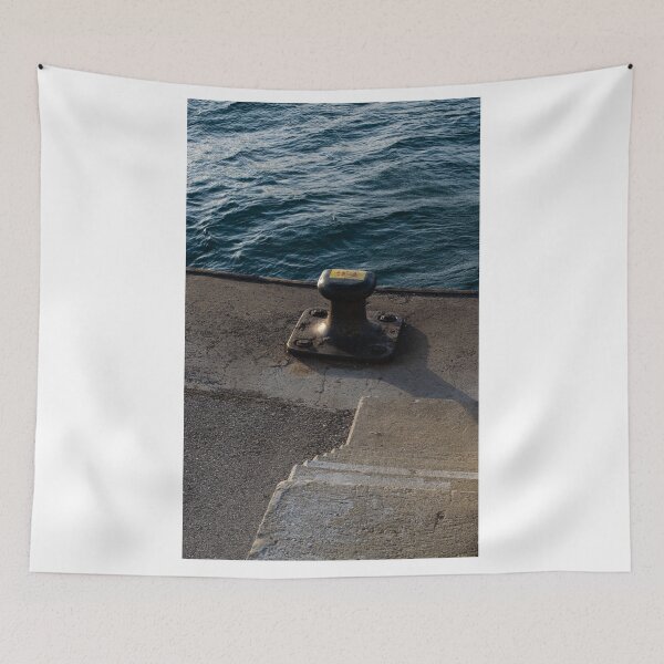 Item preview, sea bollard in a harbor with a sea in the background designed and sold by Alberto Morales Romero.