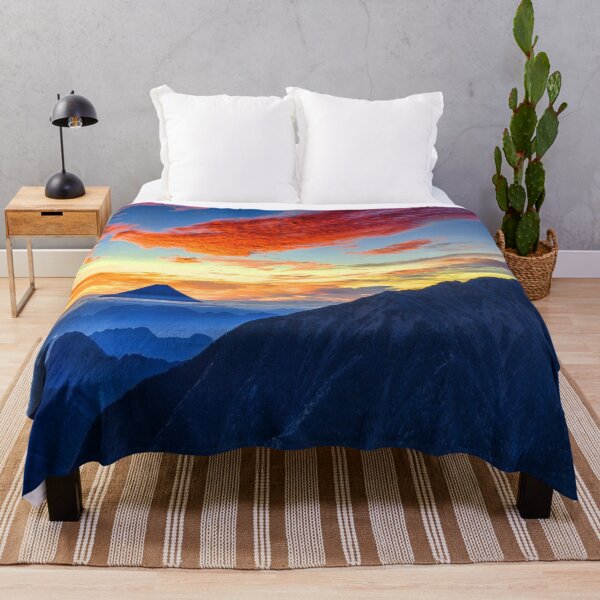 Item preview, Calm sky, Rocky mountains, dark blue, orange, yellow sky, orange clouds, hills silhouette designed and sold by August-E.
