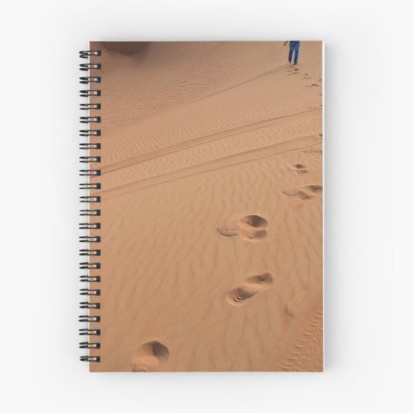 Item preview, Man walking in the desert leaving footsteps in the sand. designed and sold by oanaunciuleanu.