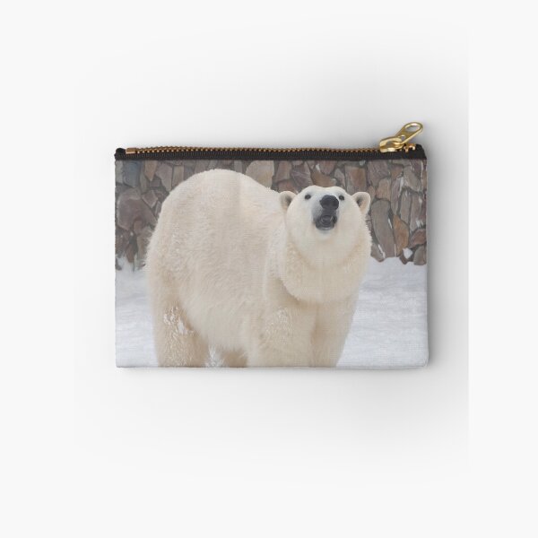 Item preview, a polar bear stands in the snow against a stone wall designed and sold by nataliavavilina.